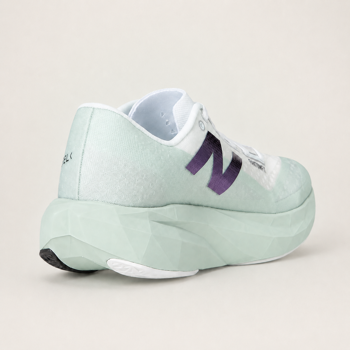 New Balance FuelCell Rebel v4 White and mint — rear view